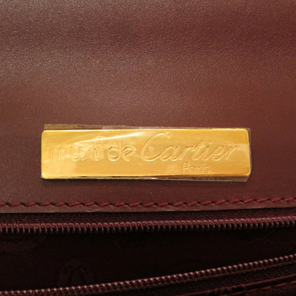 Pre-Owned must red bordeaux (Good) line Cartier leather handbag