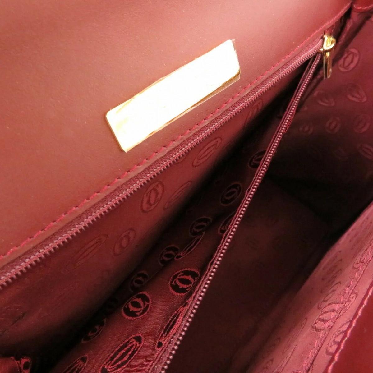 Pre-Owned must red bordeaux (Good) line Cartier leather handbag